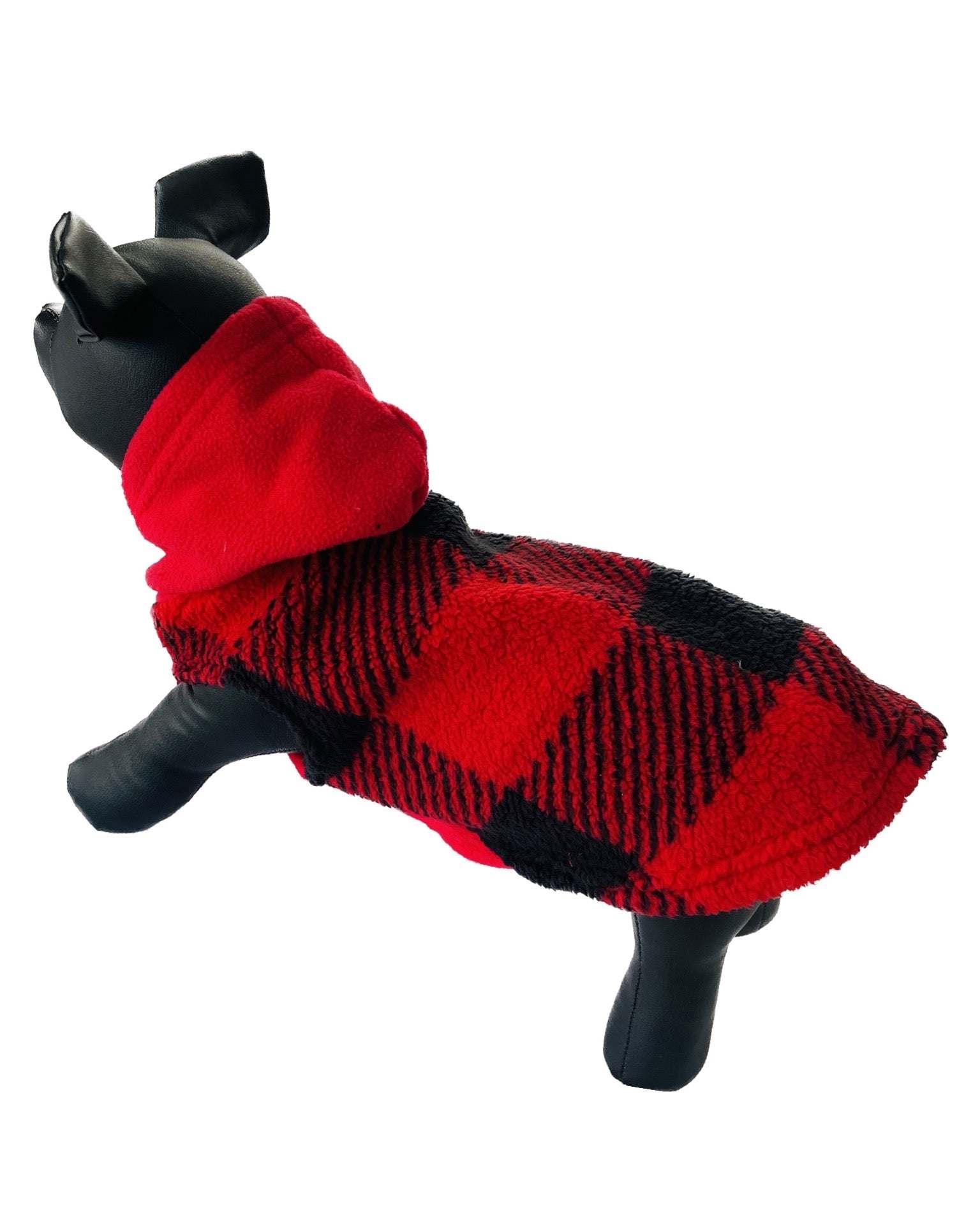 Small dog wearing a red and black plaid fleece hooded sweater with a leash hole designed for outdoor comfort and warmth
