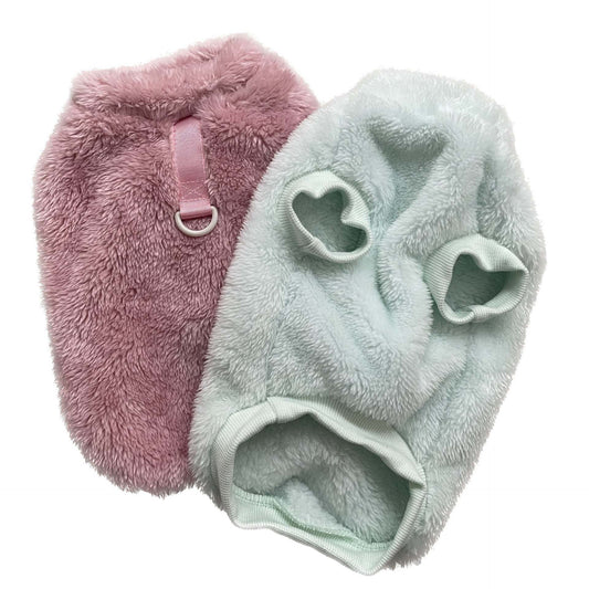 Soft and fluffy dog walking sweaters in pink and light green with leash attachment rings
