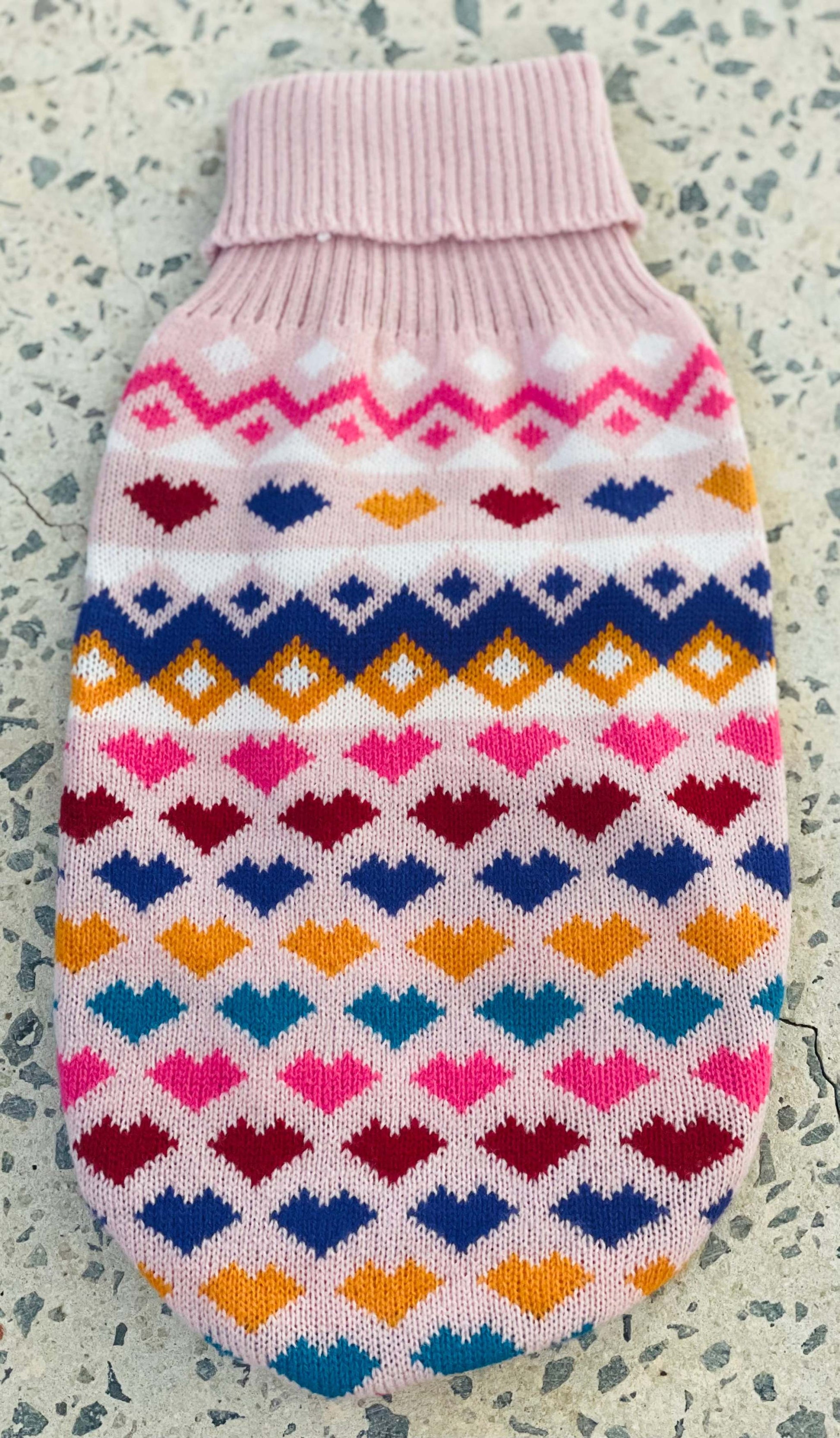 Colorful small dog knit sweater with heart and diamond patterns and a ribbed collar